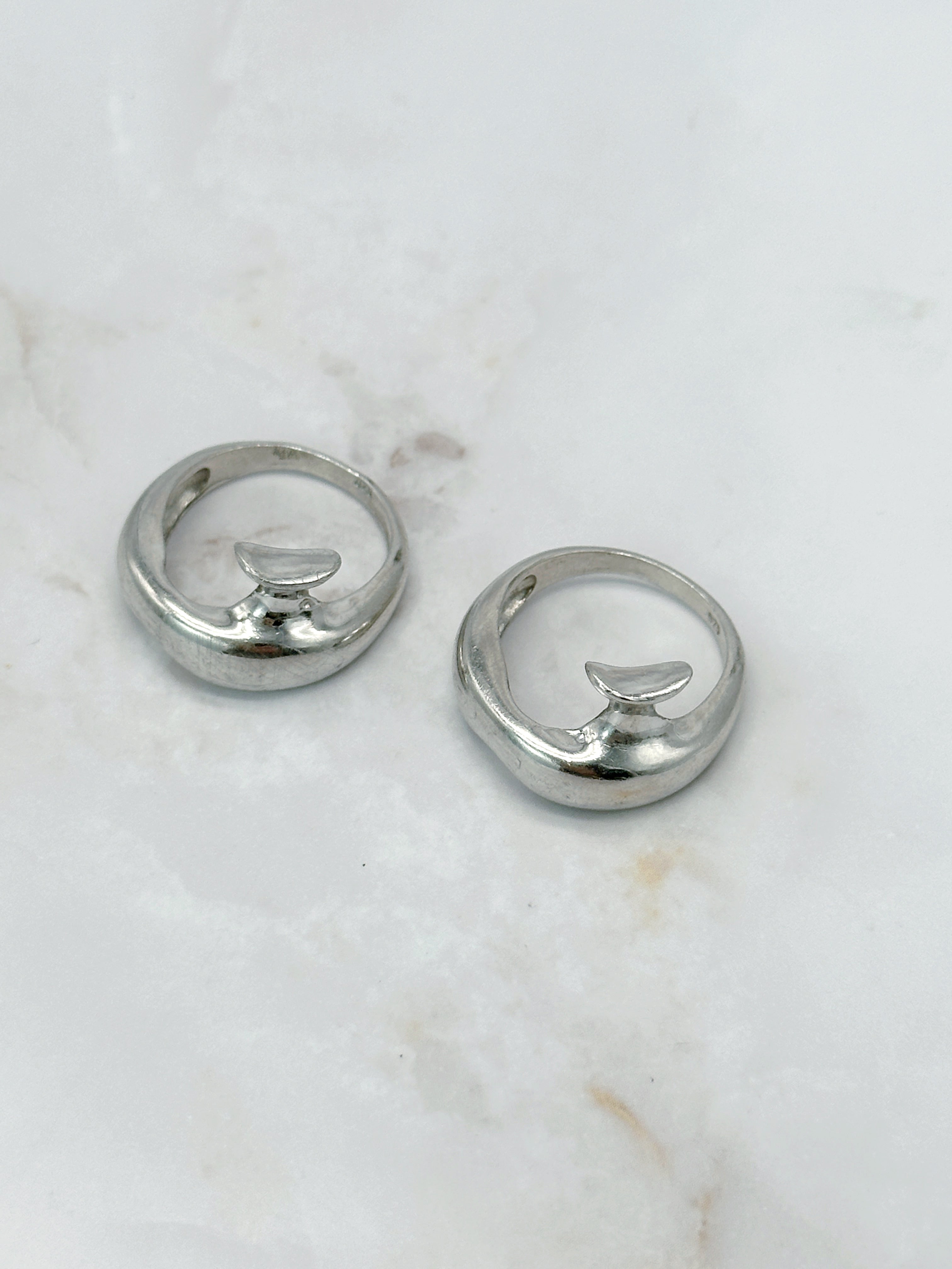 Modern silver ring in abstract form