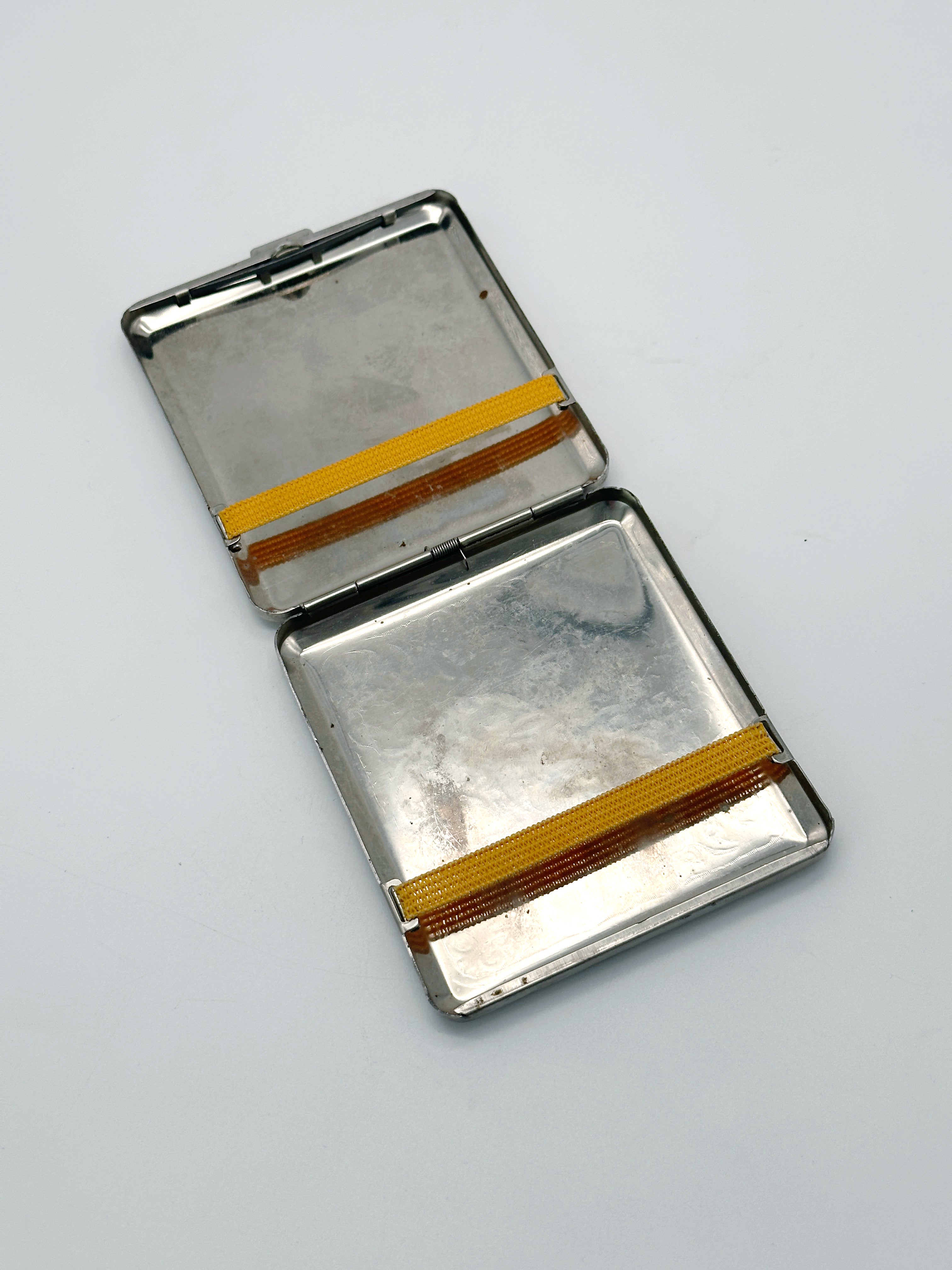Silver-plated cigarette case with vine motif