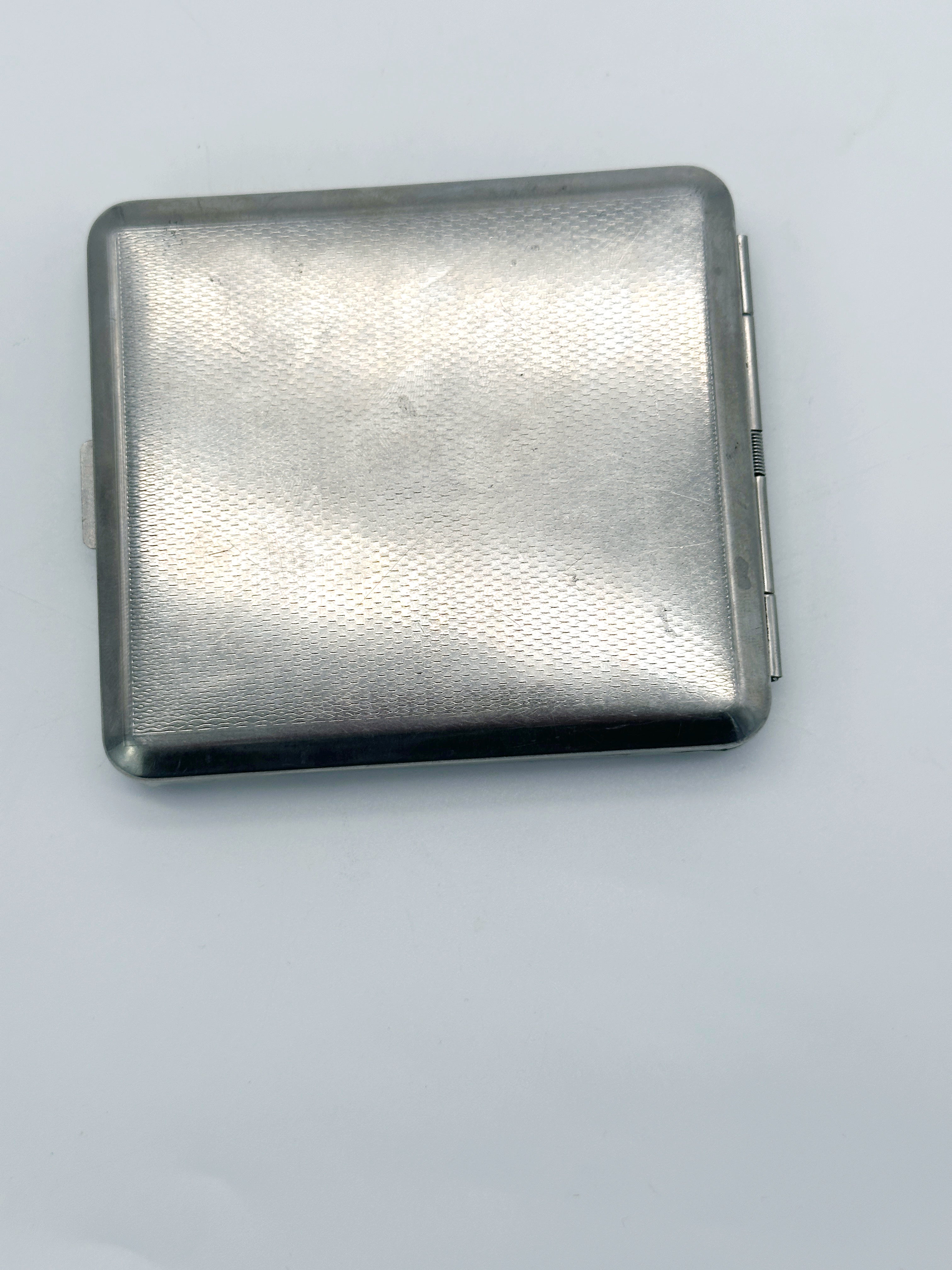 Silver-plated cigarette case with vine motif