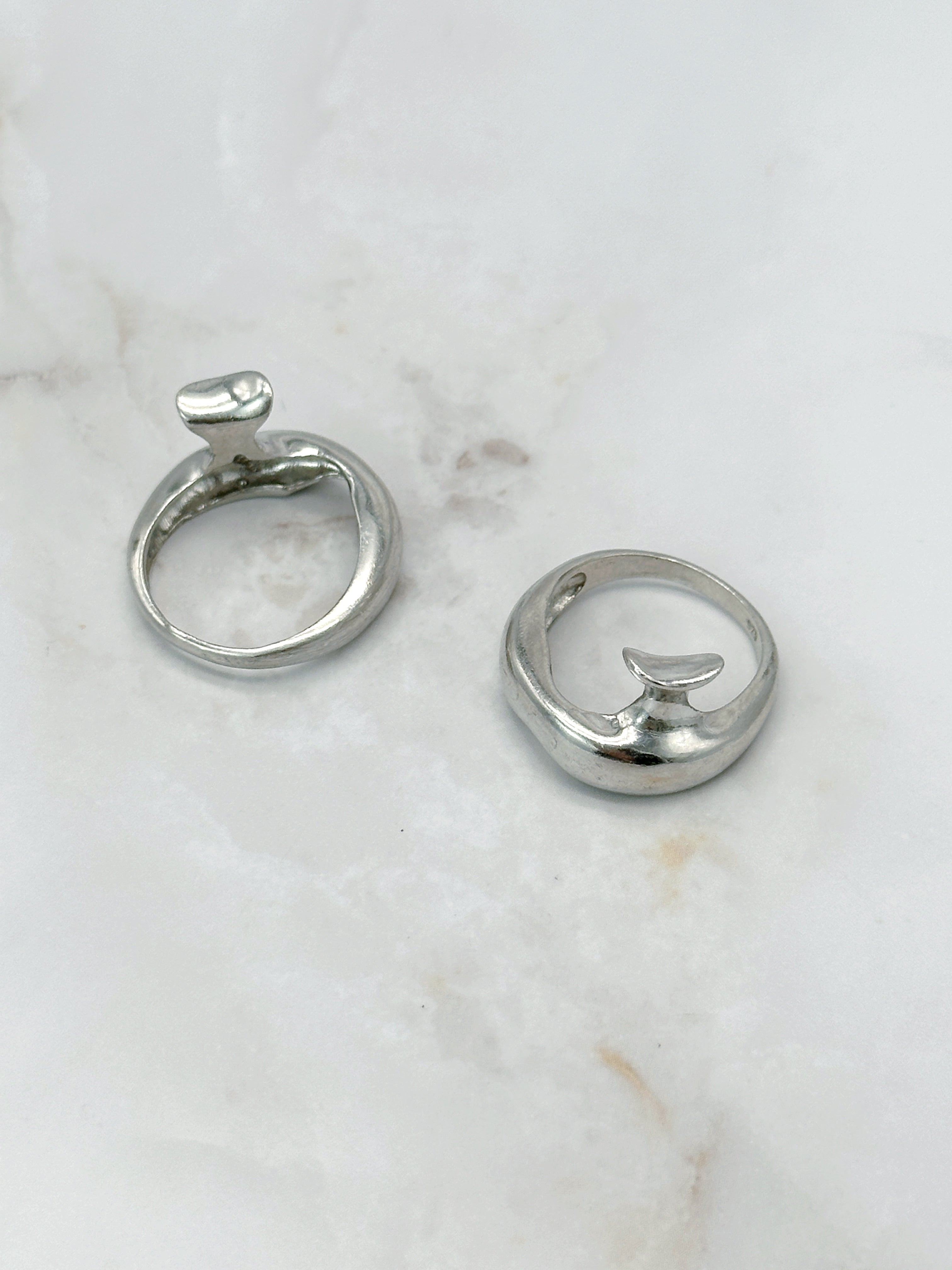 Modern silver ring in abstract form