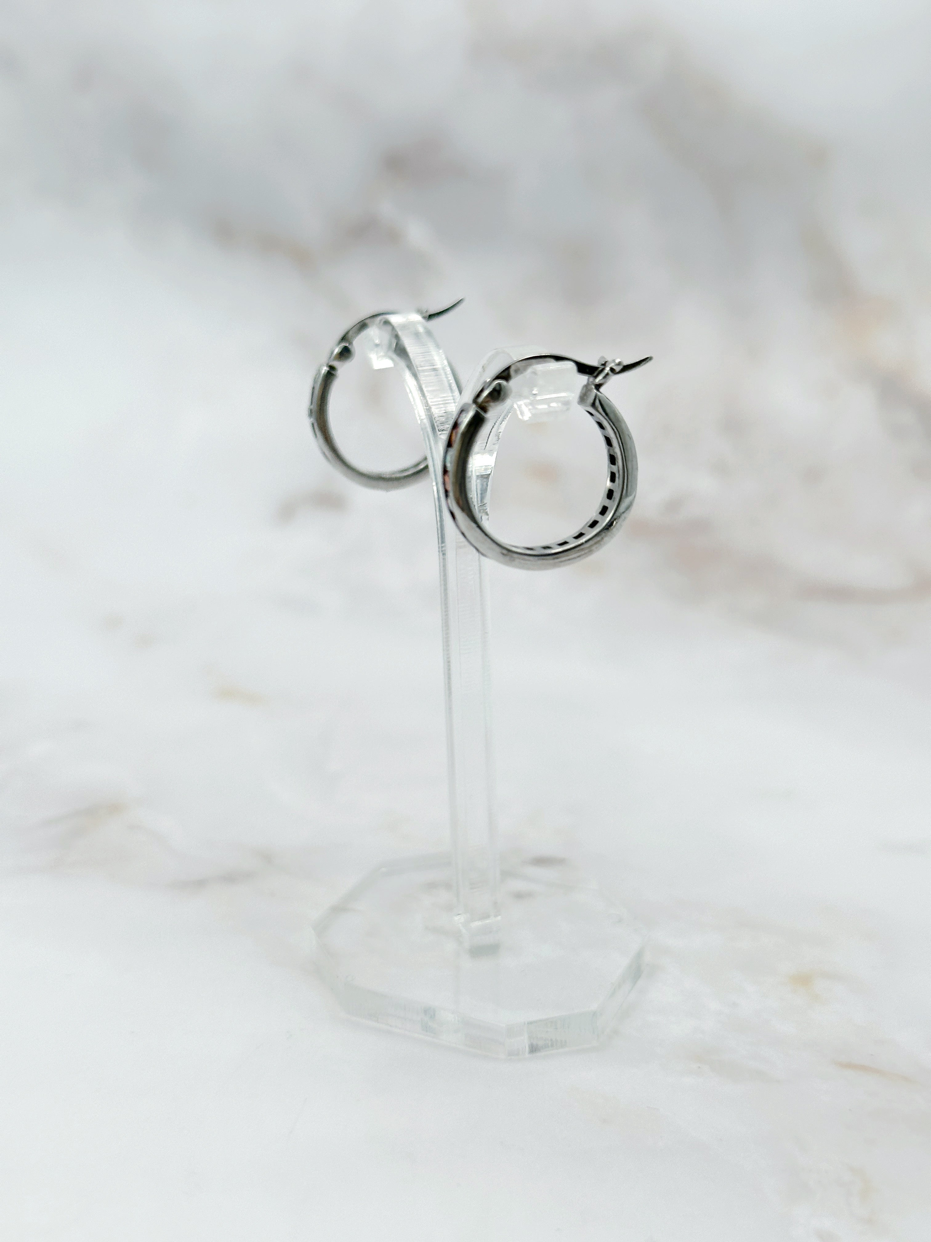 Silver earrings with orange and clear rhinestones