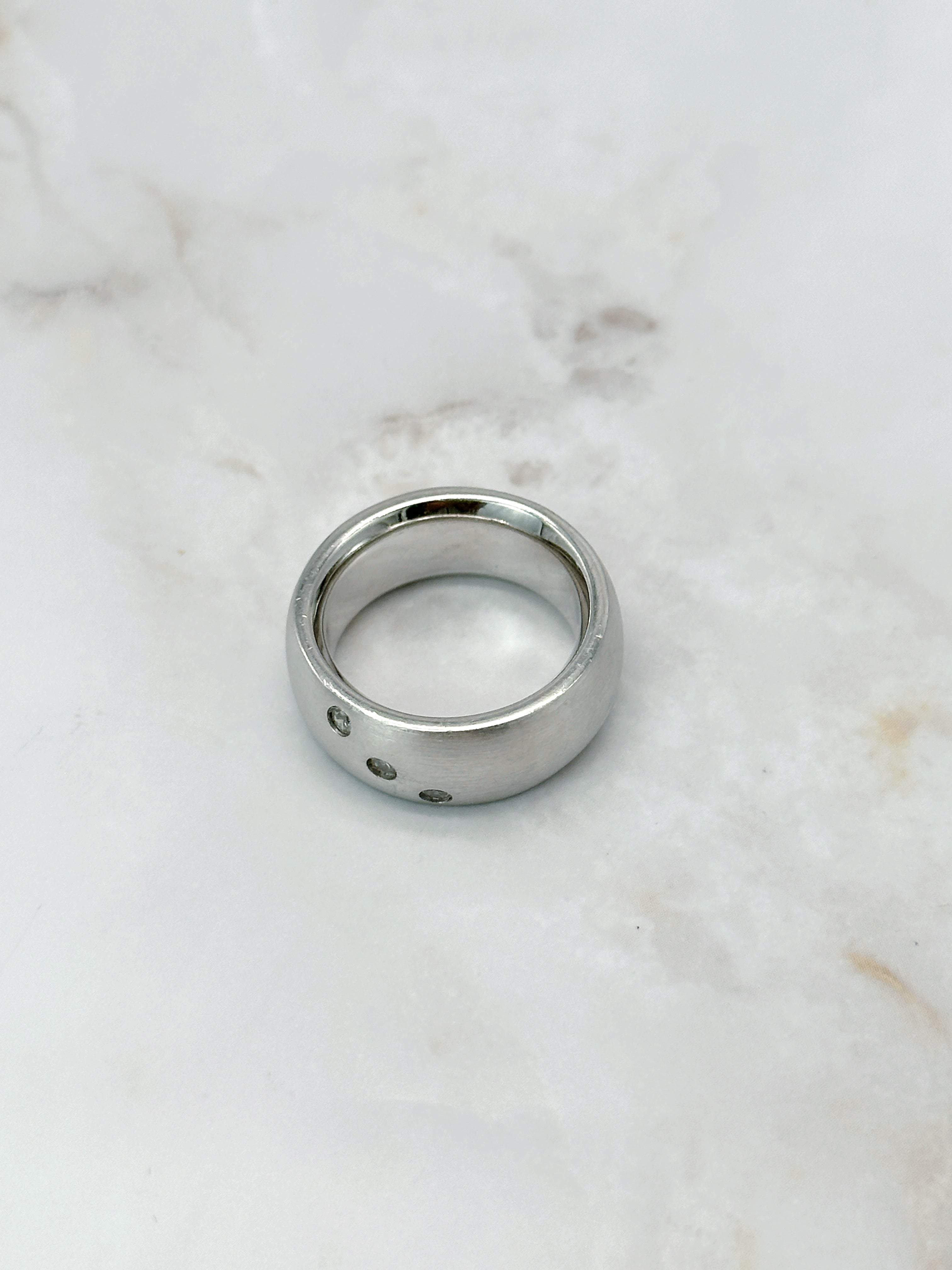 Modern silver ring with three sparkling zirconia