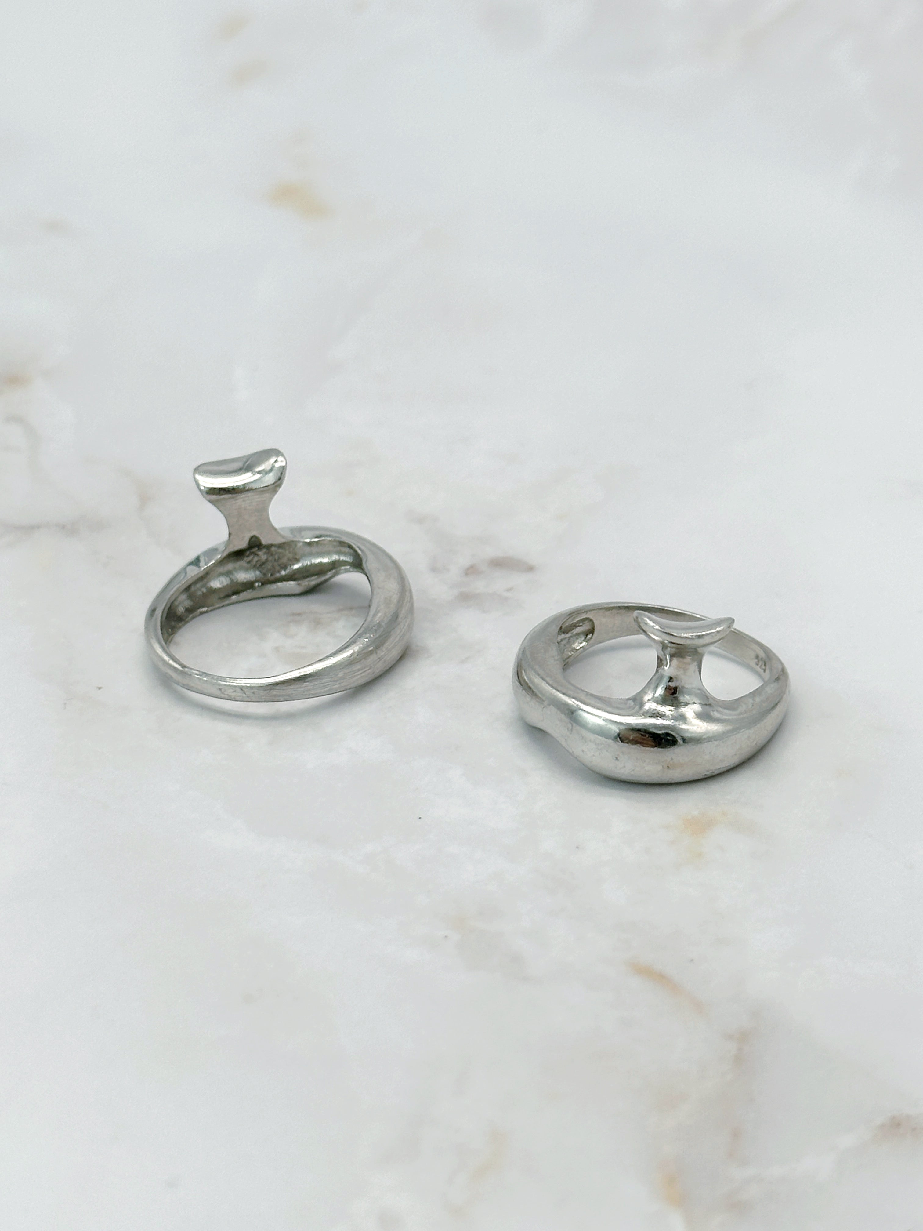 Modern silver ring in abstract form