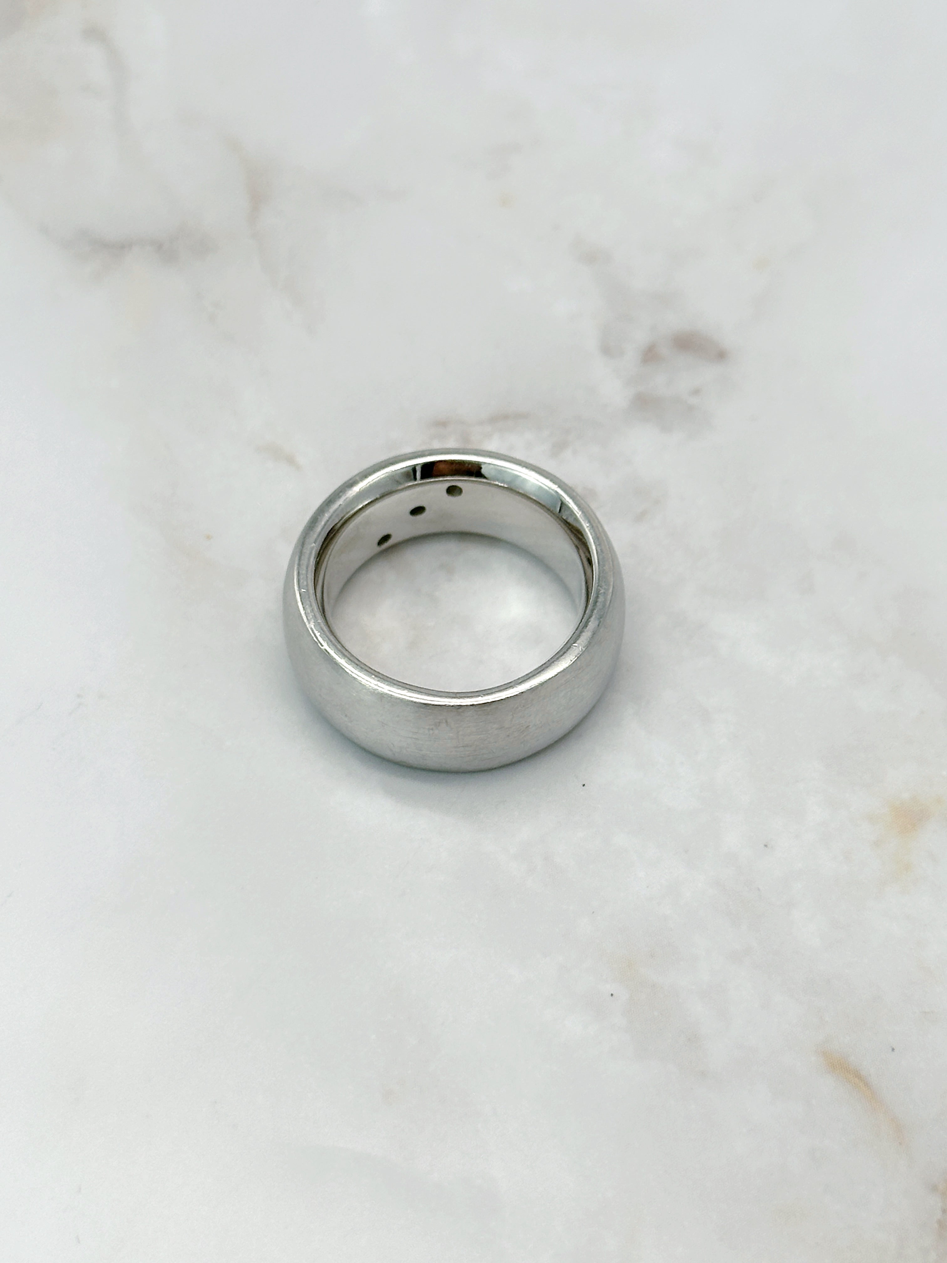 Modern silver ring with three sparkling zirconia