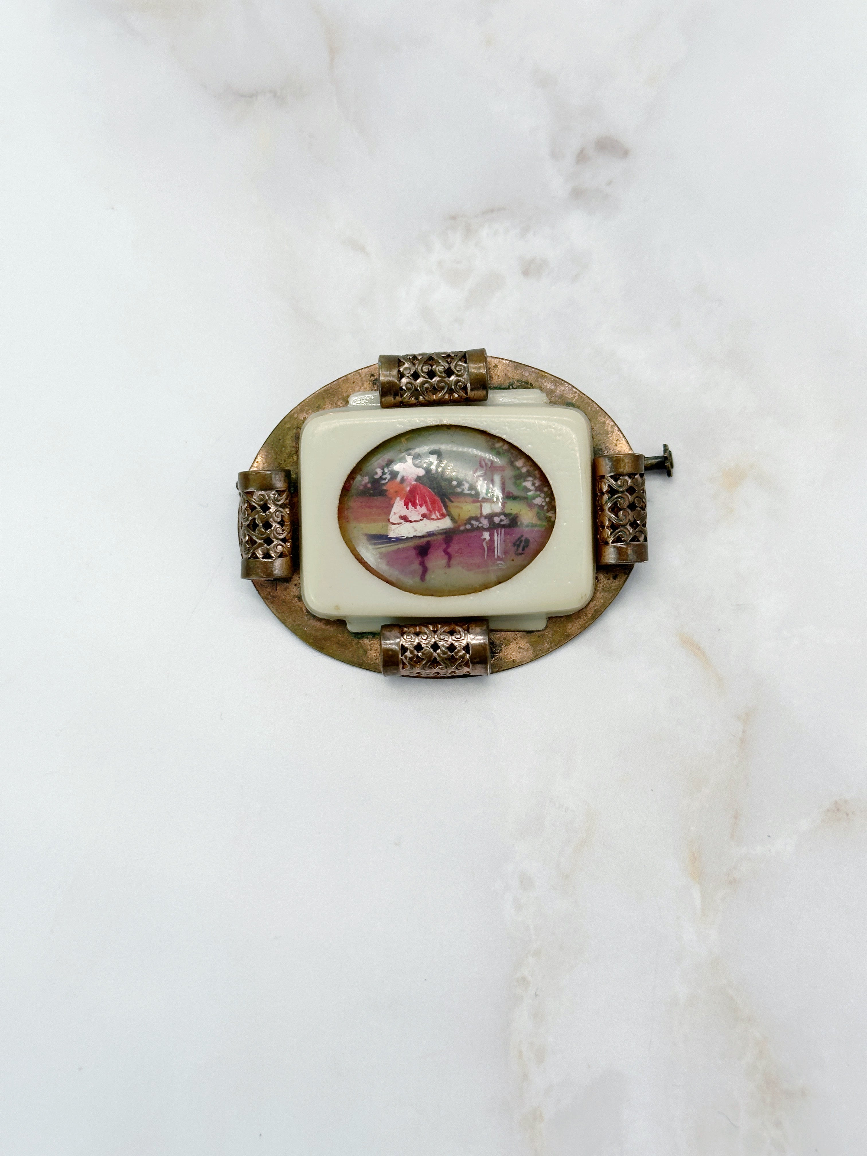 Vintage brooch with reverse glass painting on plastic