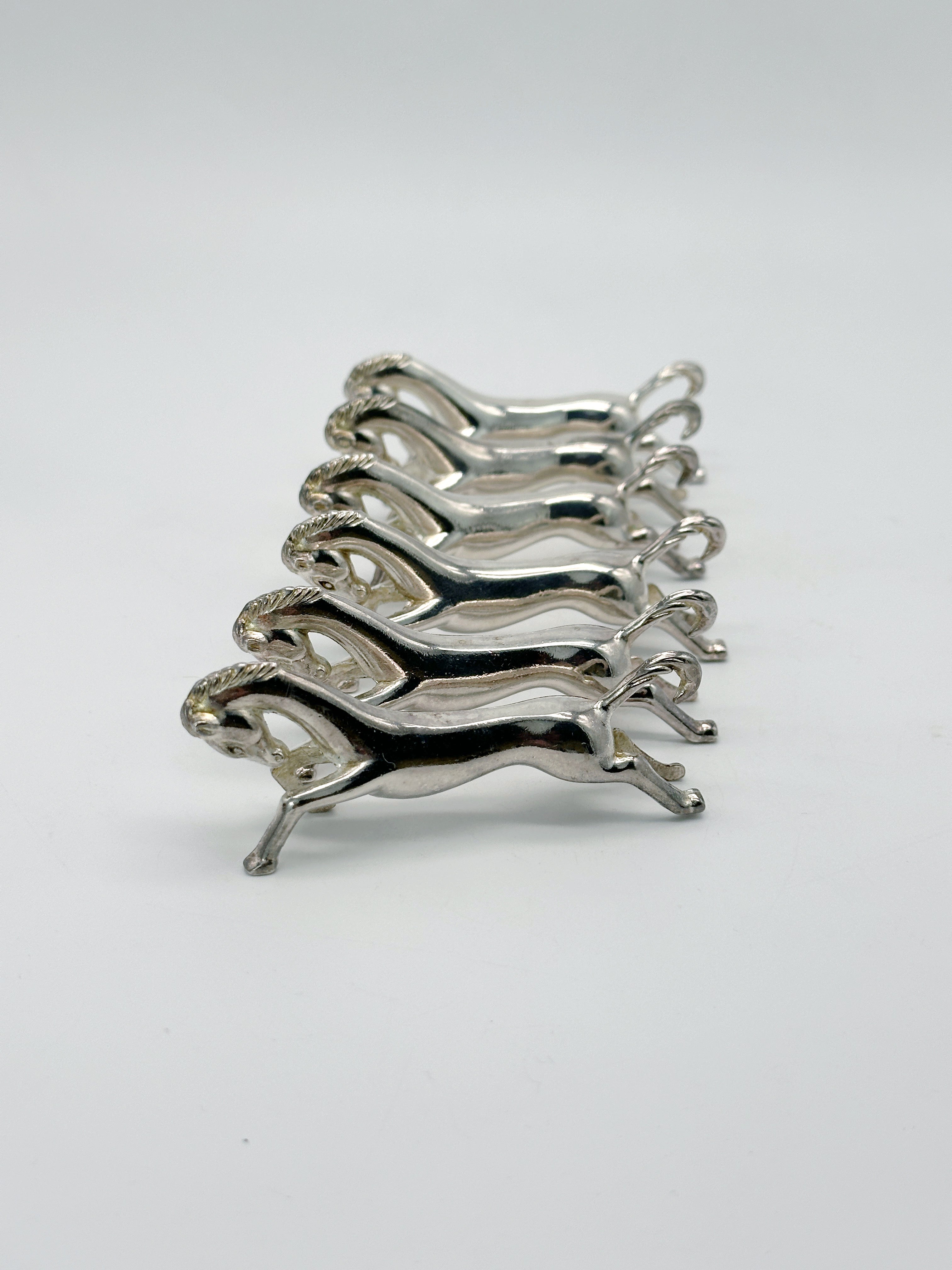 Set aus 6 versilberten Messerbänkchen Pferd