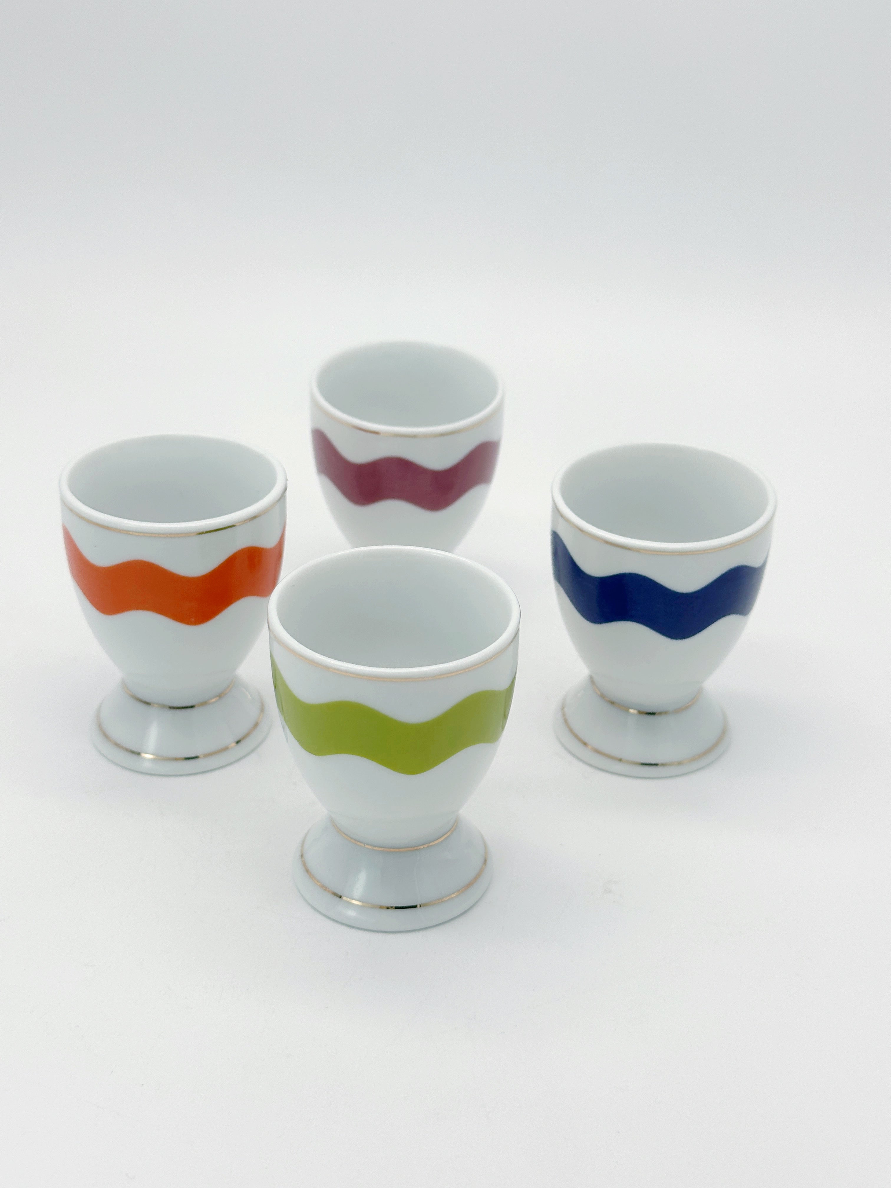 Set aus 4 bunten Porzellan Eierbechern mit Goldrand