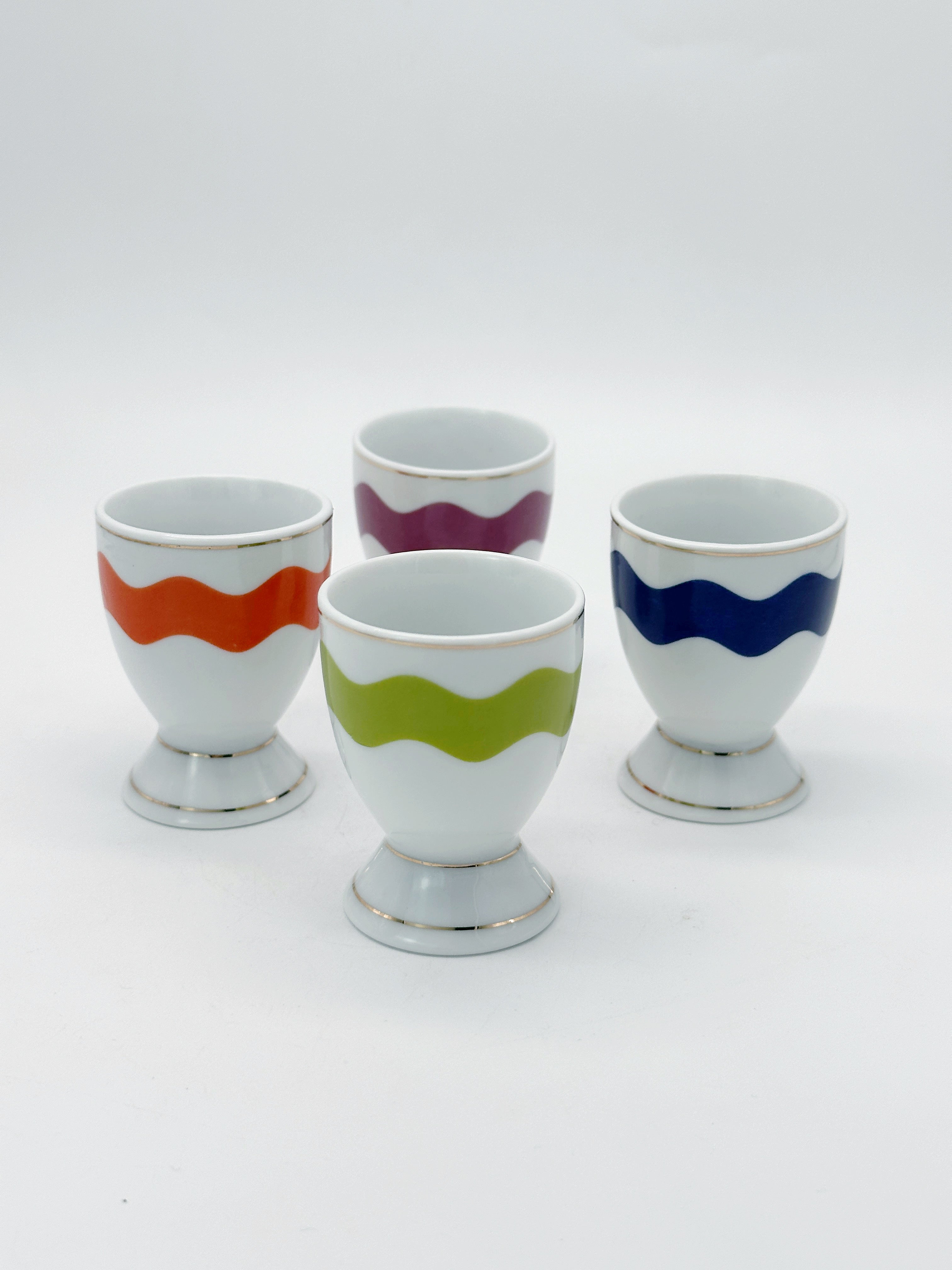 Set aus 4 bunten Porzellan Eierbechern mit Goldrand