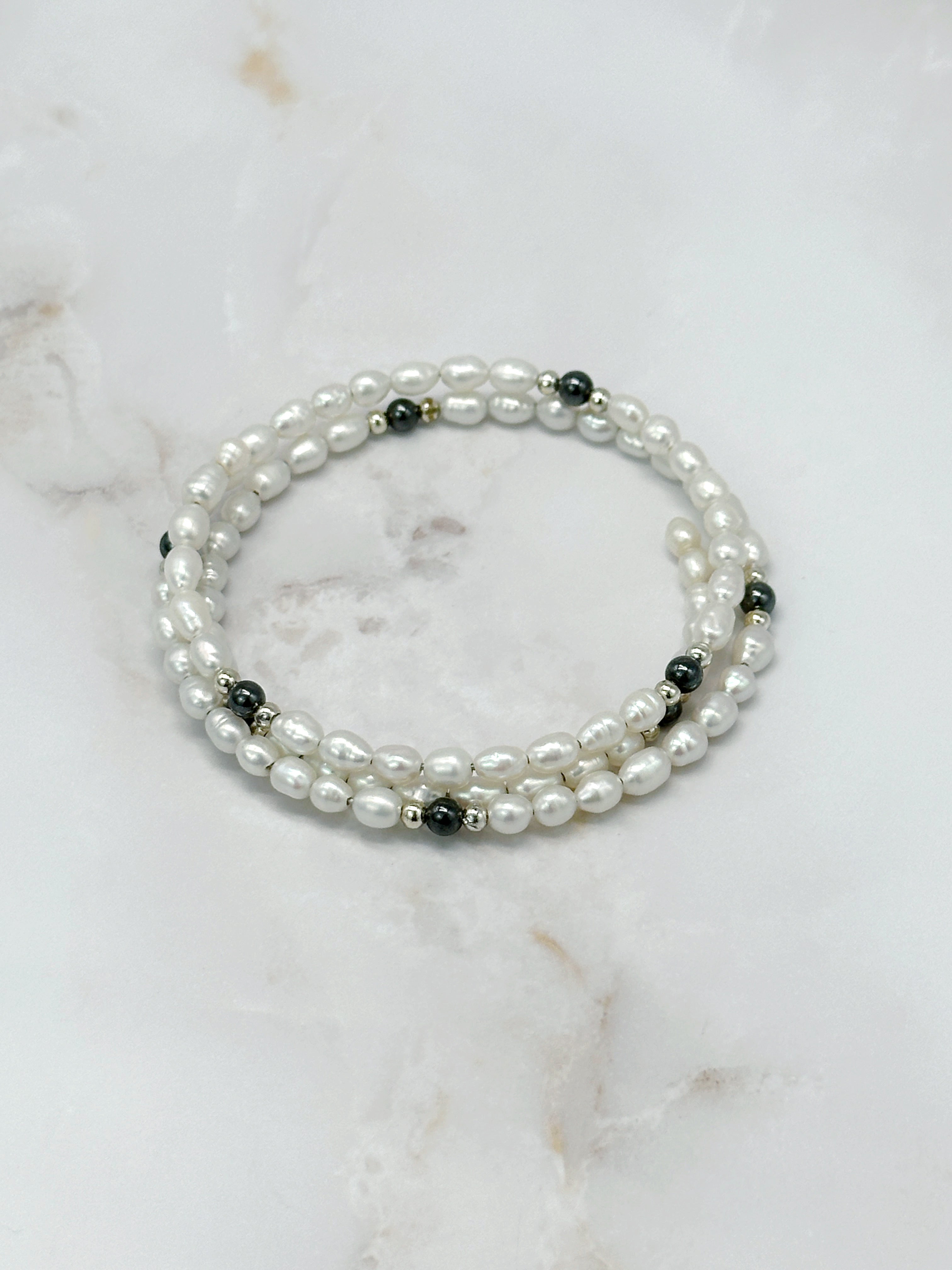 Flexible bangle with faux pearls and hematite