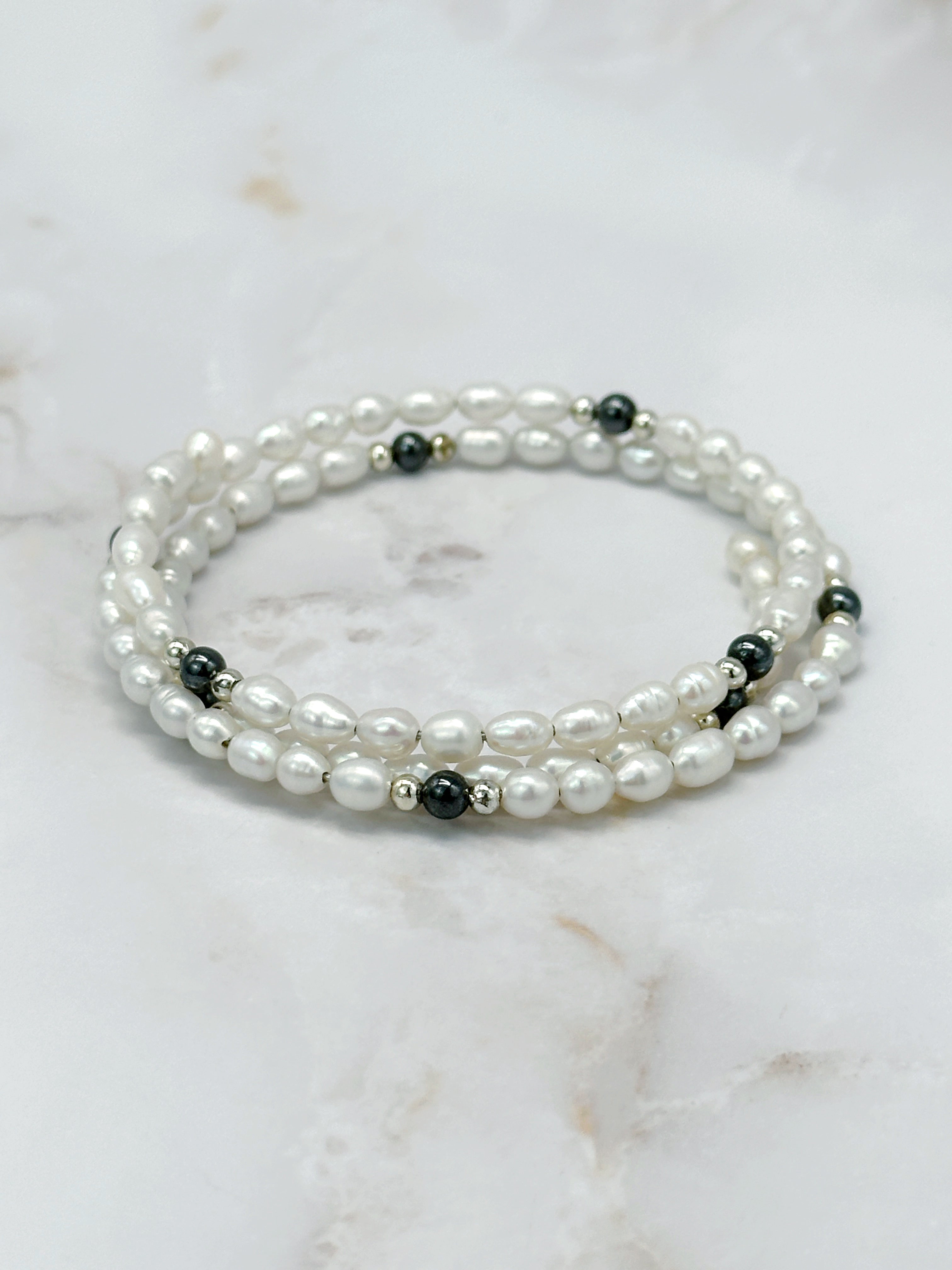 Flexible bangle with faux pearls and hematite