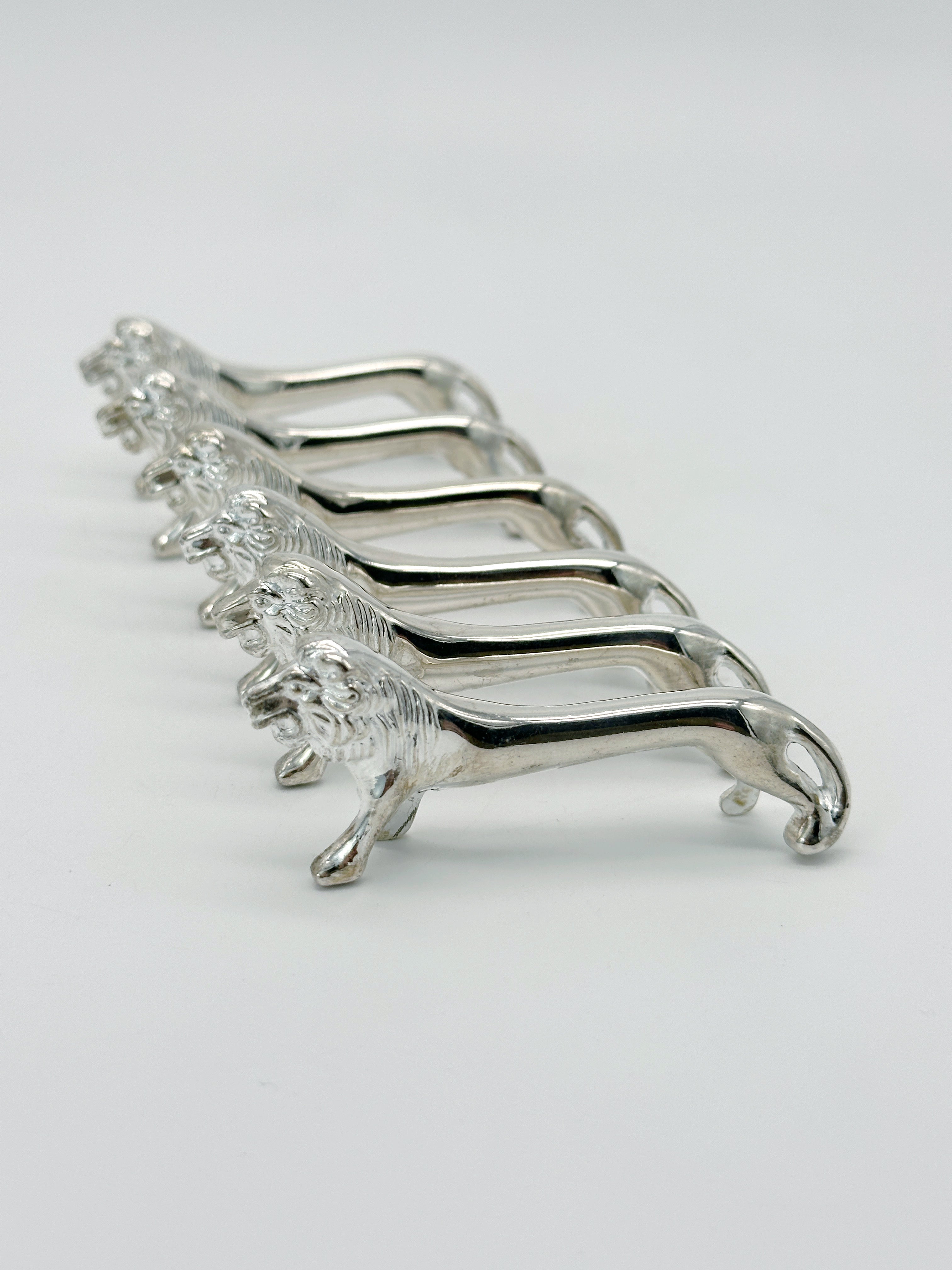 Set aus 6 versilberten Messerbänkchen Löwe