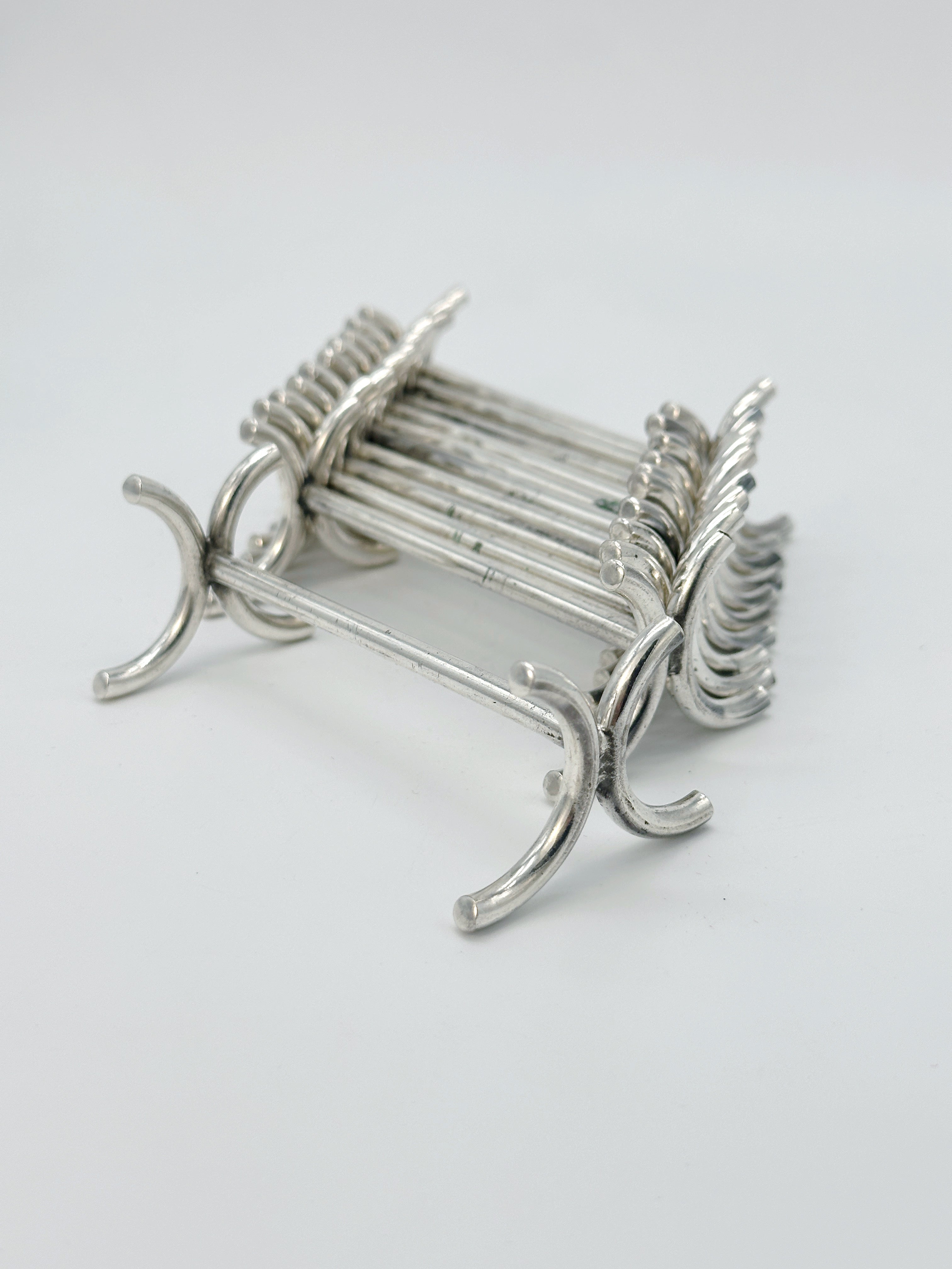 Set von 12 Art Déco Messerbänkchen, versilbert
