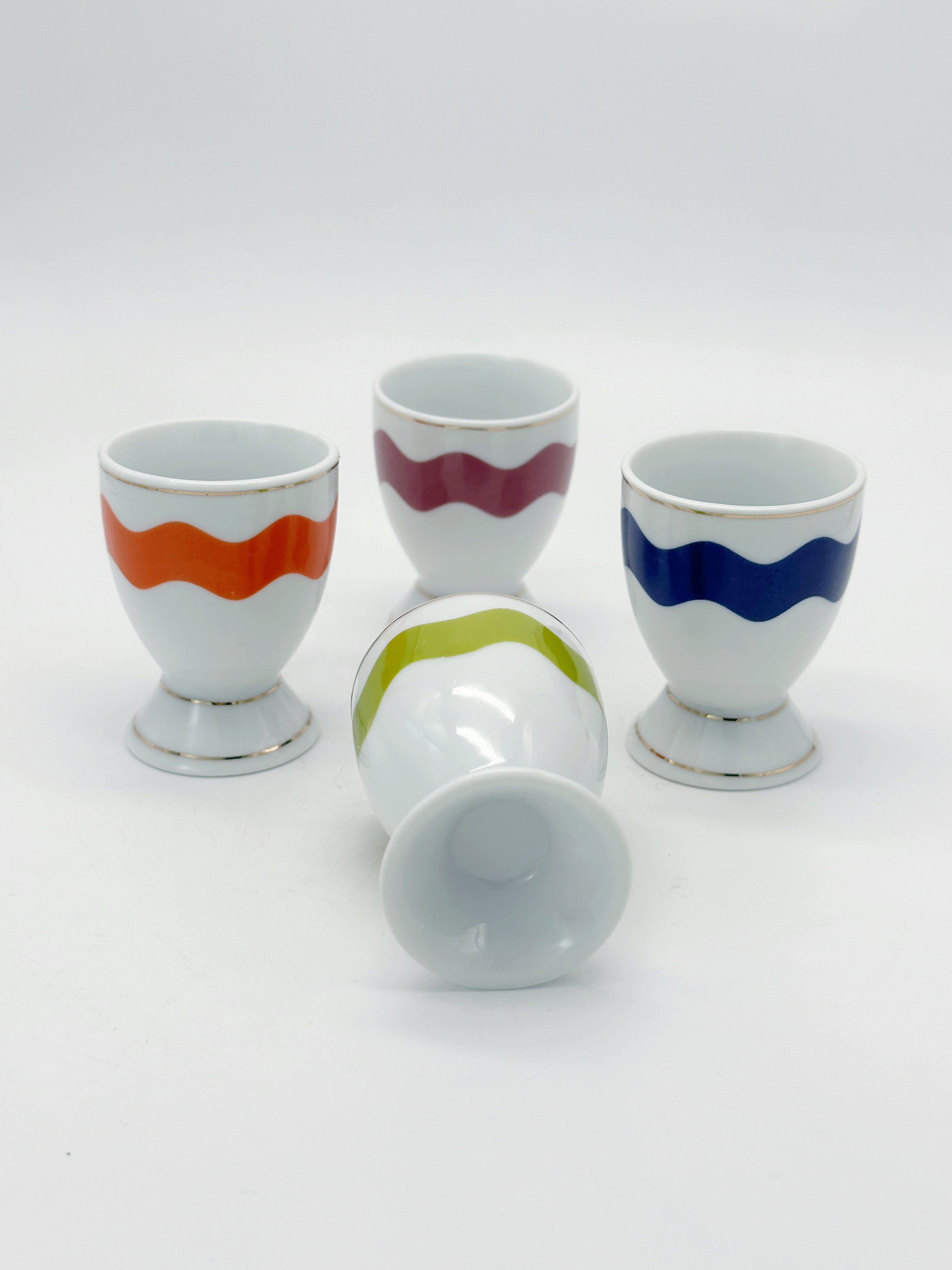 Set aus 4 bunten Porzellan Eierbechern mit Goldrand