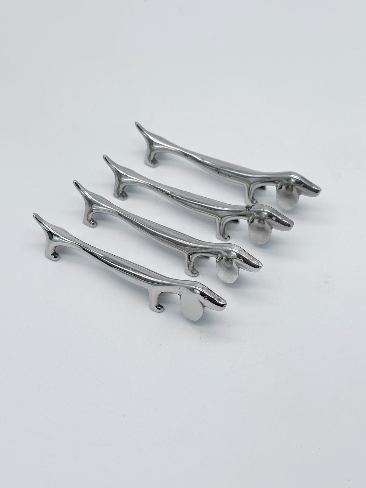 Versilberte Vintage Messerbänkchen in Dackelform – 4er-Set