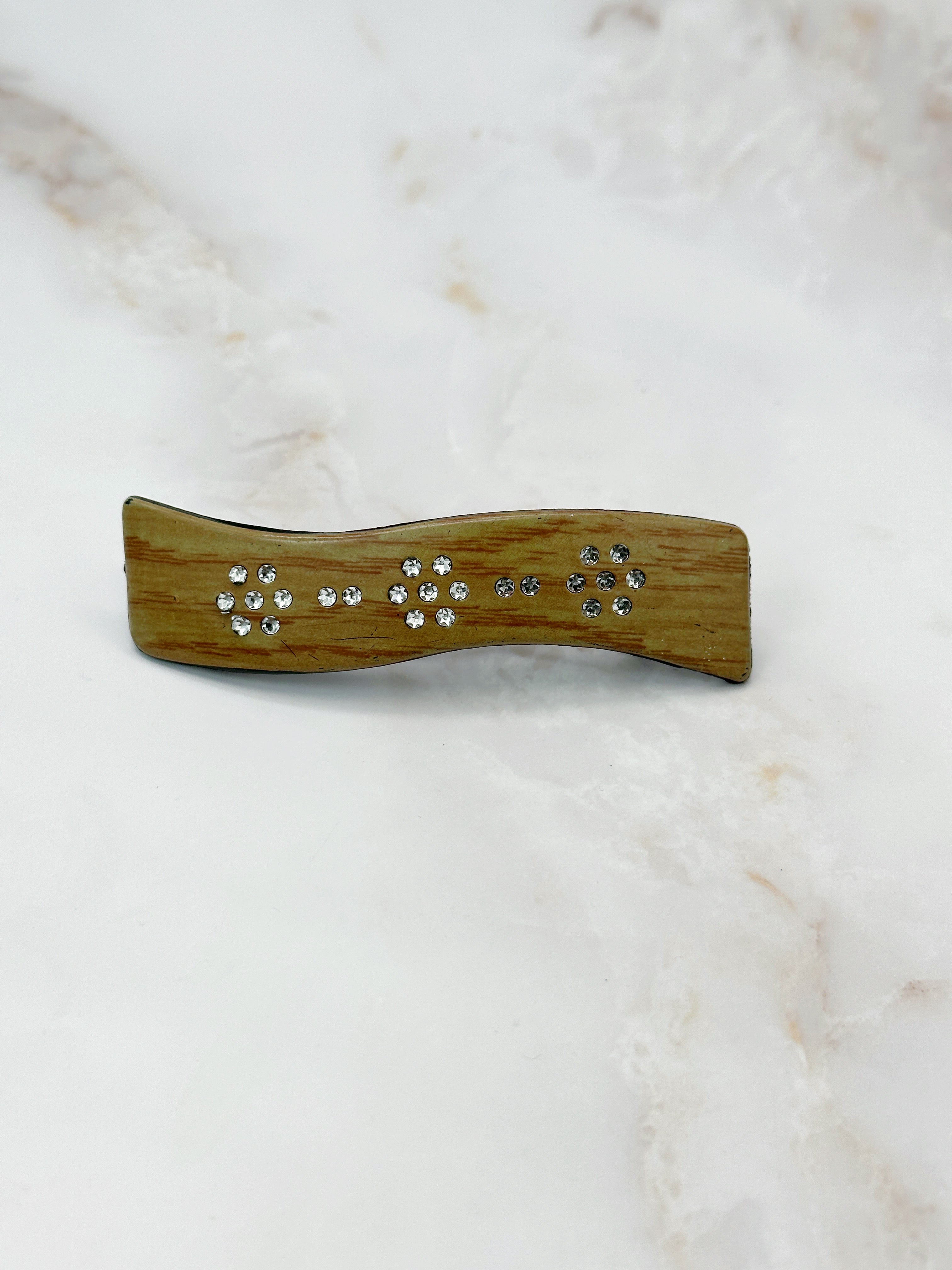 Sparkling wave-shaped hair clip with rhinestones