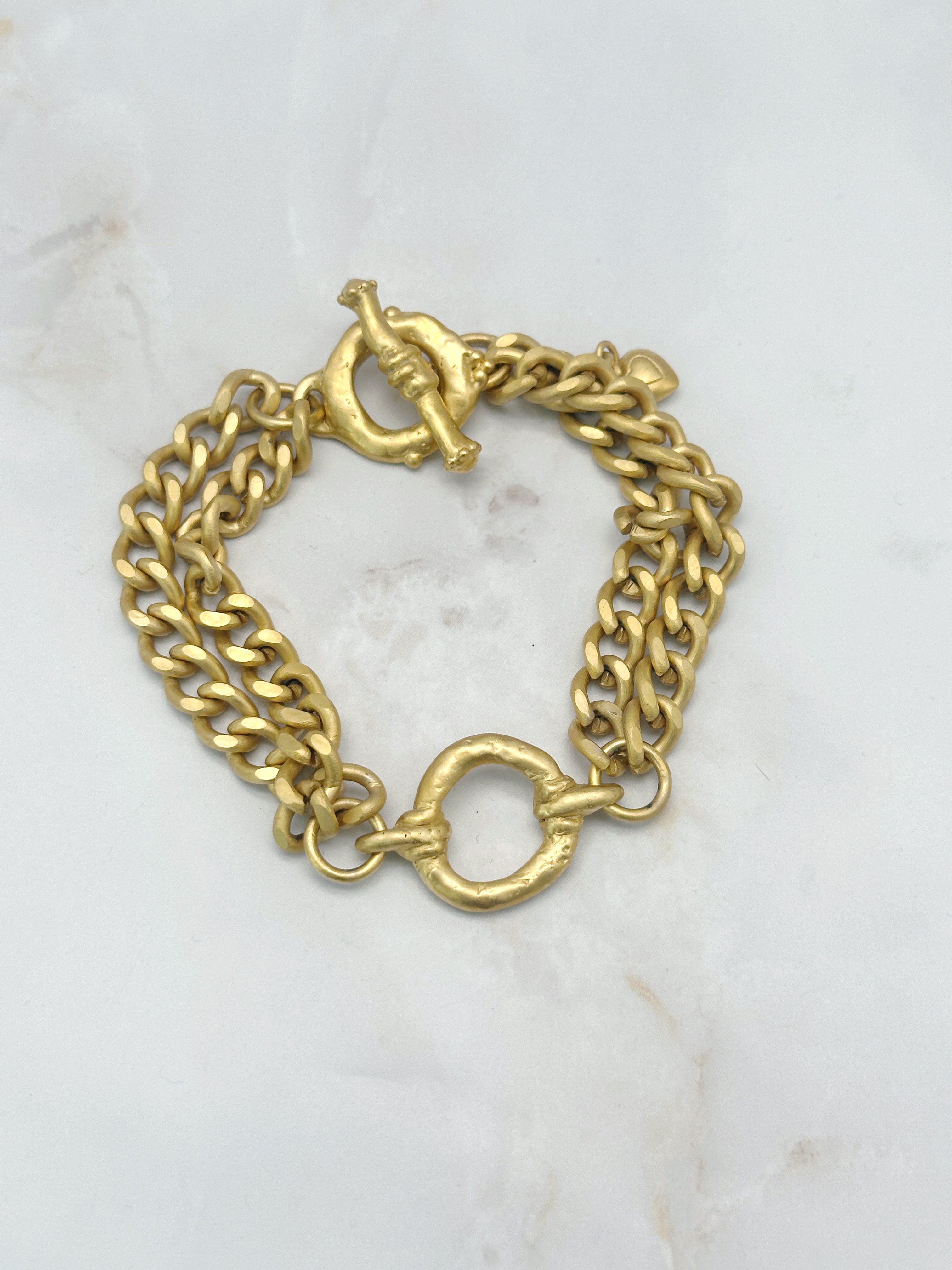 Vintage Armband aus matt vergoldetem Metall mit Ring-Mittelstück