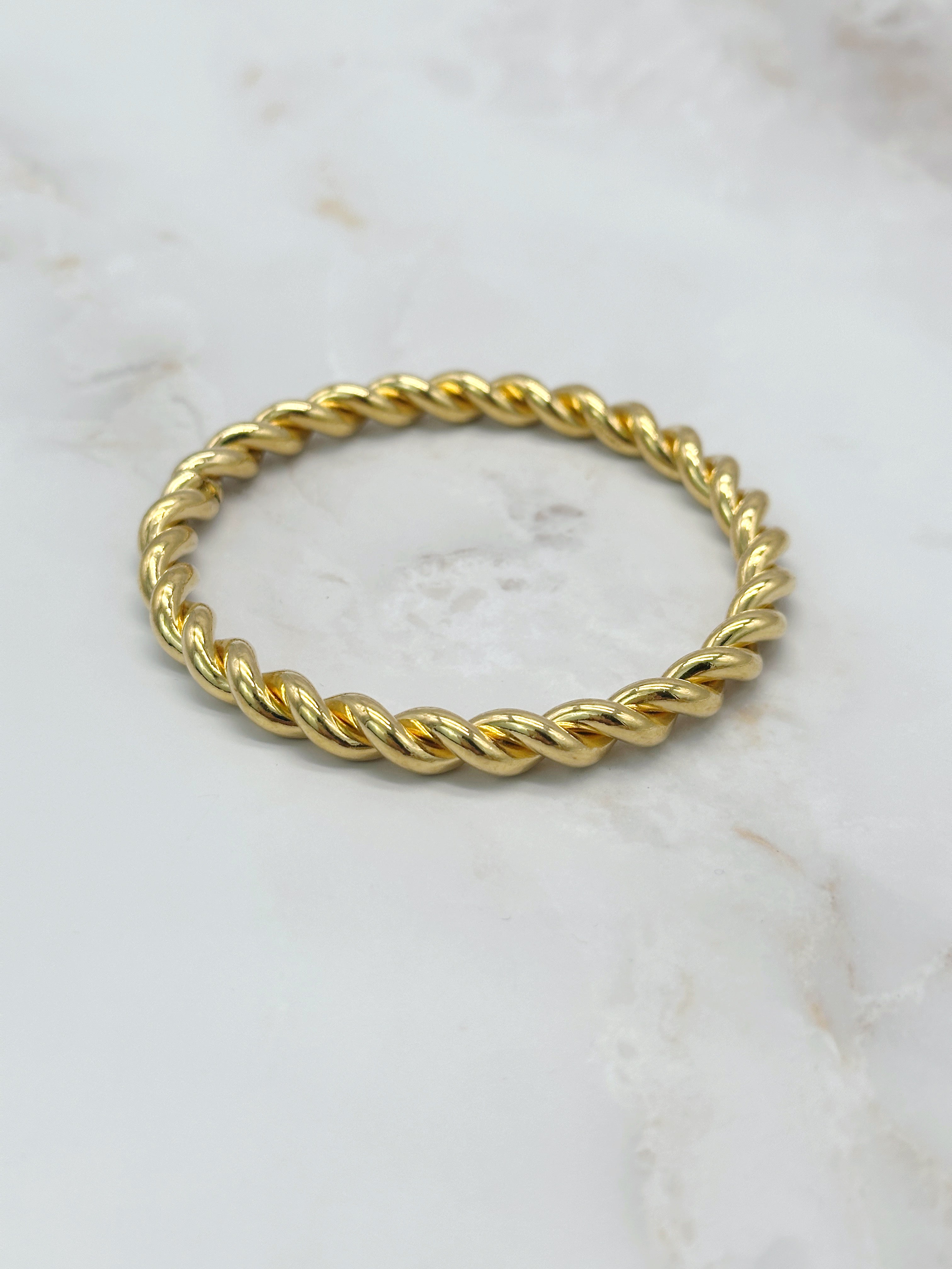 Elegant vintage bangle, twisted and gold-plated